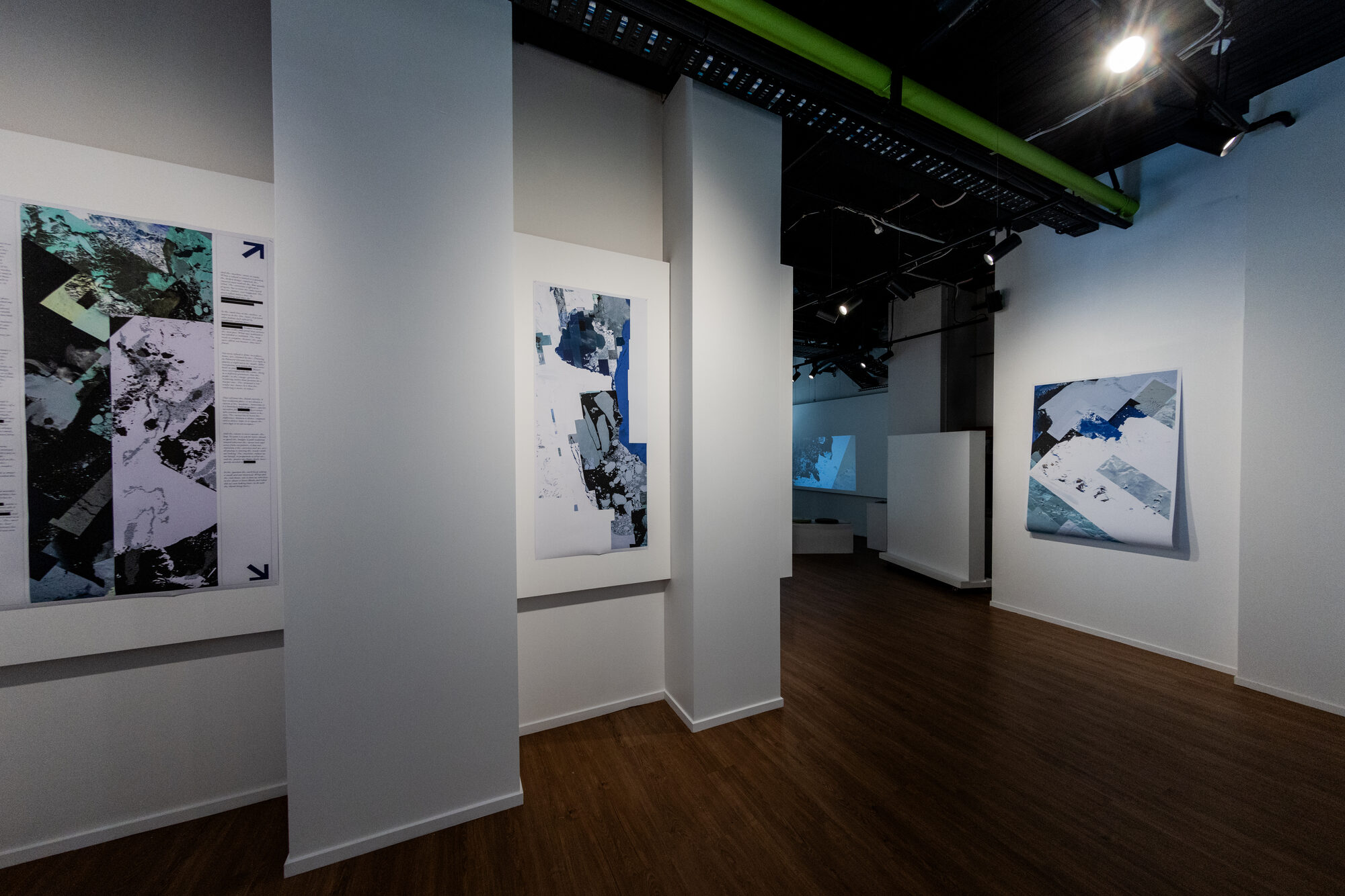 Looking down the corridor, plates in the foreground and projection beyond