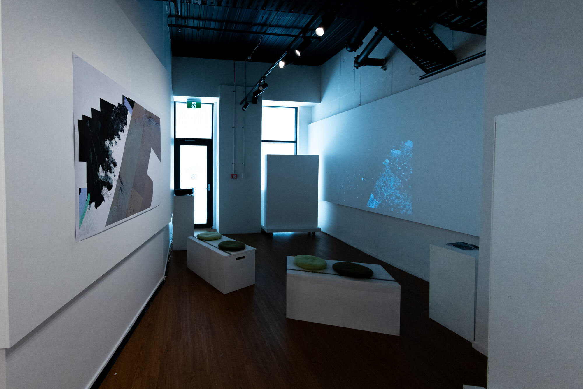 The projection room — a dark plate facing moving imagery across the space